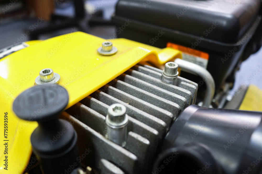 Photo of a tractor engine being repaired in a workshop