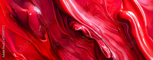 A splash of a transparent red liquid red color of plastisol ink flowed out of the barrel. plastisol ink is specially for print on tee shirts and any fabric Marble texture. Paint splash High quality. photo