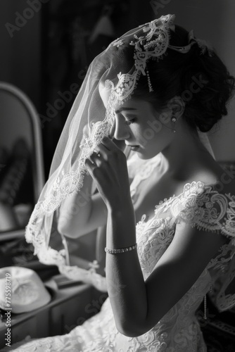 a bride on her wedding day putting on her dress - black and white wedding photography