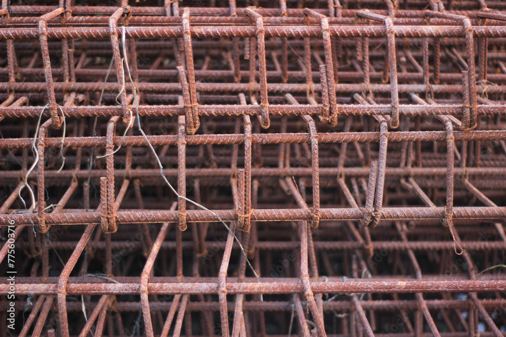 piles of steel bars and rusty reinforced steel on an abandoned building site piles of steel bars and rusty reinforced steel on an abandoned building site