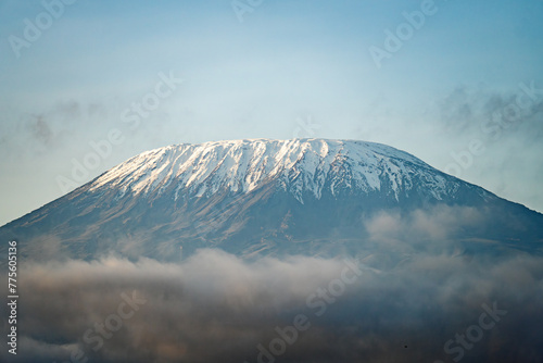 peak of the snow-covered Kilimanjaro volcano. Snow on top of Mount Kilimanjaro in Amboseli photo