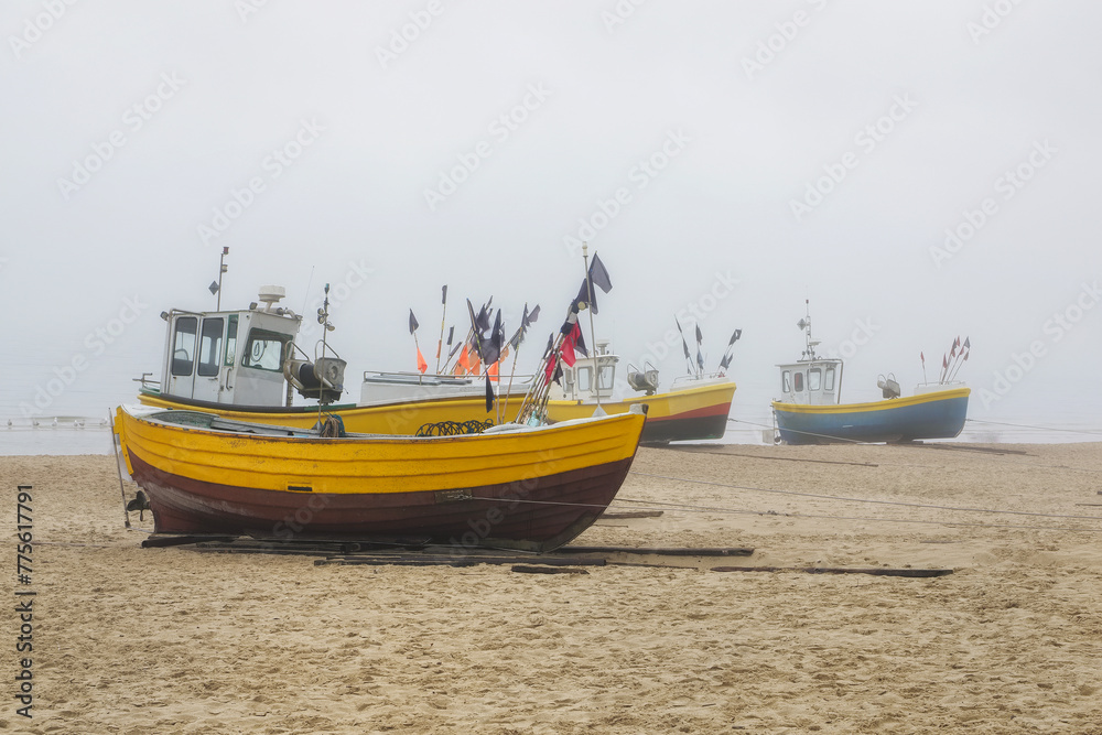 
Beach in the fog, fishing boats in the foreground. Baltic Sea, Sopot, Poland