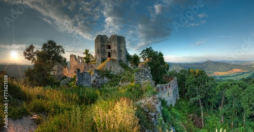 The old fortified castle  a historical ruin of a medieval castle. Ruin of castle Gymes at sunset  History of old Europe.