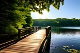 wooden bridge spanning across a serene lake.