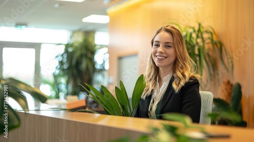 Smiling reception behind front desk