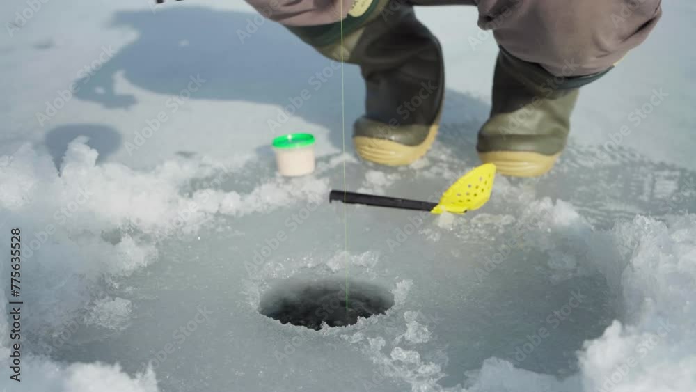 Cropped View Of A Man On Winter Ice Fishing. Close-up Shot Cropped View Of A Man On Winter Ice Fishing. Close-up Shot