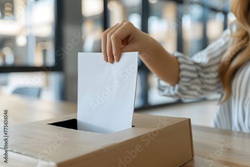 Woman Putting a Piece of Paper in a Box photo