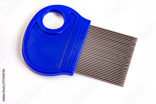 Hair lice comb, for removing nits with blue handle and small magnifying glass. isolated on white