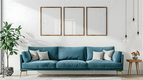 Three frames and a teal sofa against a white wall. Modern living room interior design in a Scandinavian home.