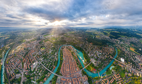 Bern, Switzerland. Panorama of the city in cloudy weather. Sun rays. Summer morning. Aerial view