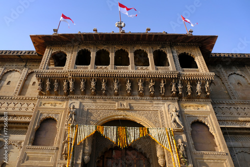 Maheshwar, Madhya Pradesh, INDIA - February 24, 2024, Exterior View of the scenic tourist landmark Maheshwar fort (Ahilya Fort) and temple. This monument is on the banks of the Narmada River. photo