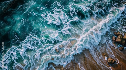 Aerial view of waves crashing on the beach. Beautiful seascape