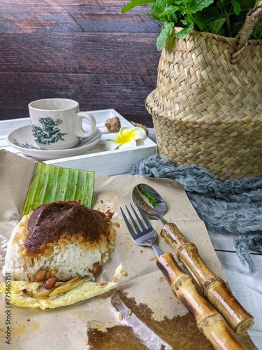 Malaysian local food known as nasi lemak daun pisang for breakfast photo