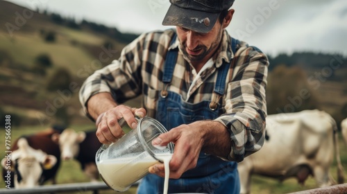 Dairy farmer in checkered shirt pouring fresh milk. Sustainable farming and agriculture concept