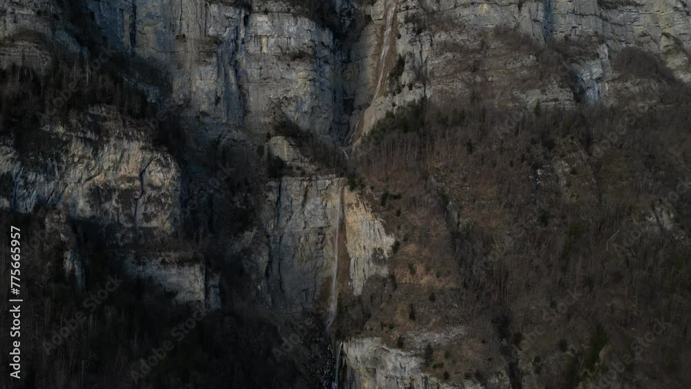 Receding view from the Seerenbachfälle waterfalls. Rocks over which water flows and attracts visitors to the Swiss Alps to an amazing sight. Aerial view Receding view from the Seerenbachfälle waterfalls. Rocks over which water flows and attracts visitors to the Swiss Alps to an amazing sight. Aerial view