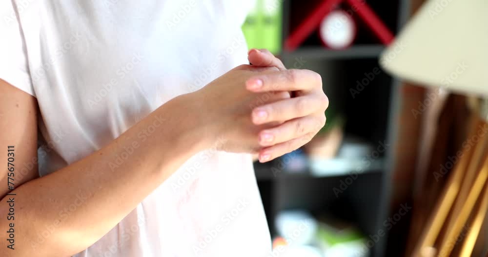 Vidéo Stock Woman suffers from pain in hands and massages painful hands