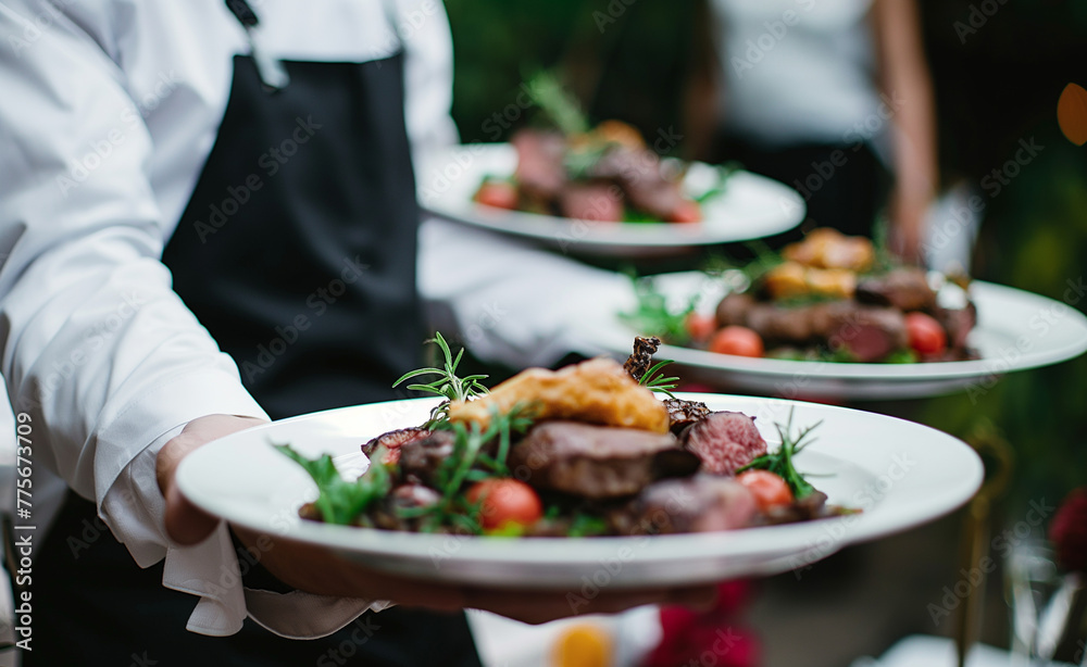 Waiter Carrying Meat Dishes at Festive Event Waiter Carrying Meat Dishes at Festive Event