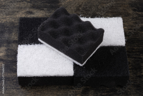 Black and white synthetic cleaning sponges with hard urethane layers