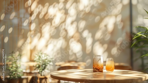 Golden morning light caresses a serene cafe setting with a touch of greenery