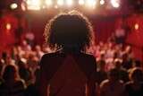 An anonymous performer stands before an enraptured audience, capturing the essence of live entertainment and connection.