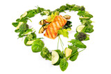 Heart Shape green Salad and Vegetables with Grilled Salmon isolated on white Background