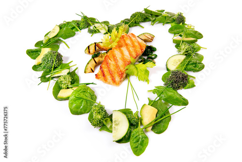 Heart Shape green Salad and Vegetables with Grilled Salmon isolated on white Background