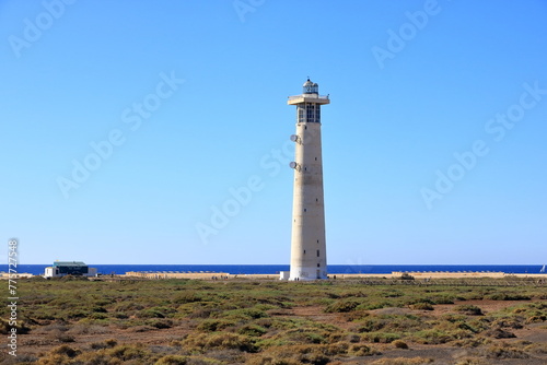 Faro de Morro Jable, Lighthouse on Morro Jable beach on Jandia peninsula in sunrise light, Fuerteventura, Canary Islands, Spain