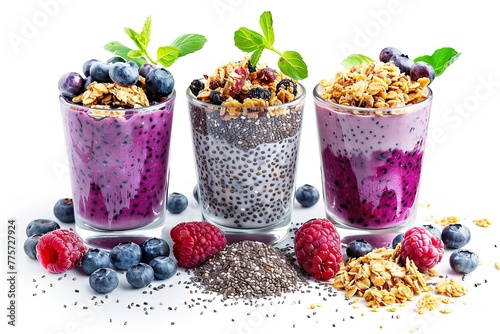 Three glasses with assorted smoothies granola and fresh berries, chia seeds on white background, heathy vibe