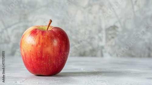 Red fresh healthy apple on a table symbolizes nutrition and organic food choices