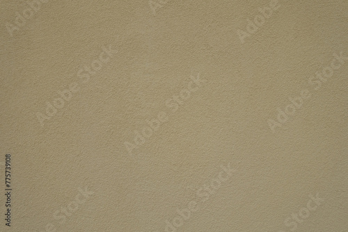 Texture of wall with coarse light beige roughcast finish photo
