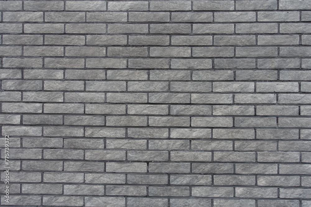 Background - gray artificially aged brick veneer wall Background - gray artificially aged brick veneer wall