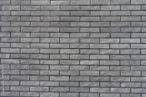 Background - gray artificially aged brick veneer wall