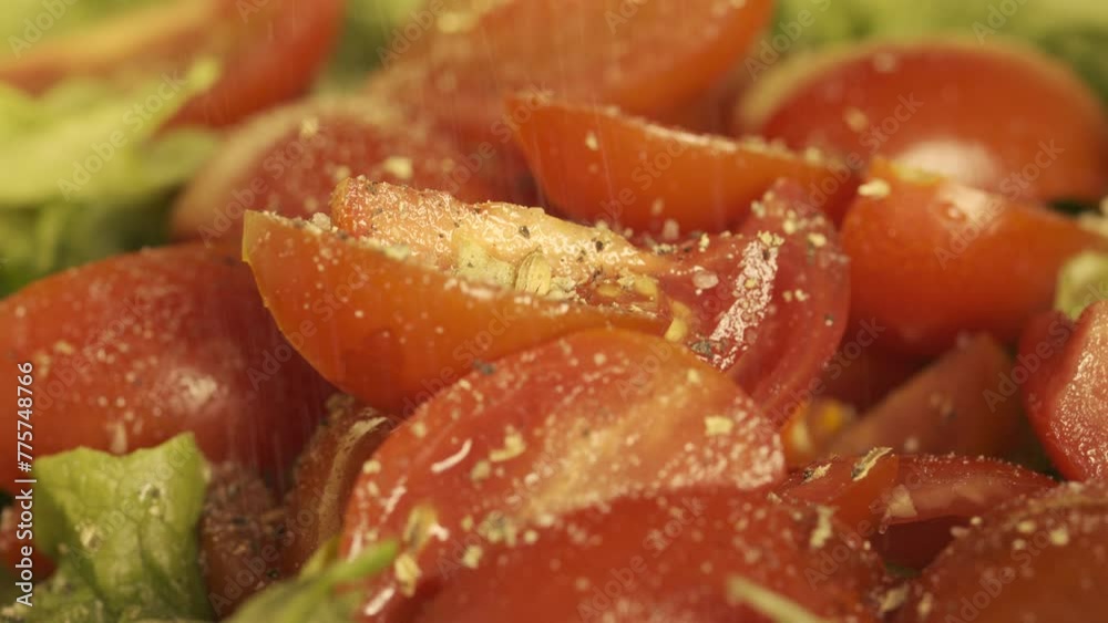 Macro UHD shot of the healthy green salad being seasoned by various herbs. Filmed as 6K RAW. Macro UHD shot of the healthy green salad being seasoned by various herbs. Filmed as 6K RAW.