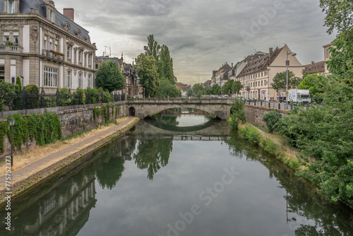 Strasbourg, France - 06 28 2023: Strasbourg city: View of the typical post office bridge reflecting in the river from Jewish Gateway.