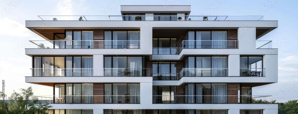 a rectangular residential building, featuring multiple floors and balconies, boasting white walls, dark-framed windows, and a grand entrance exuding sophistication.