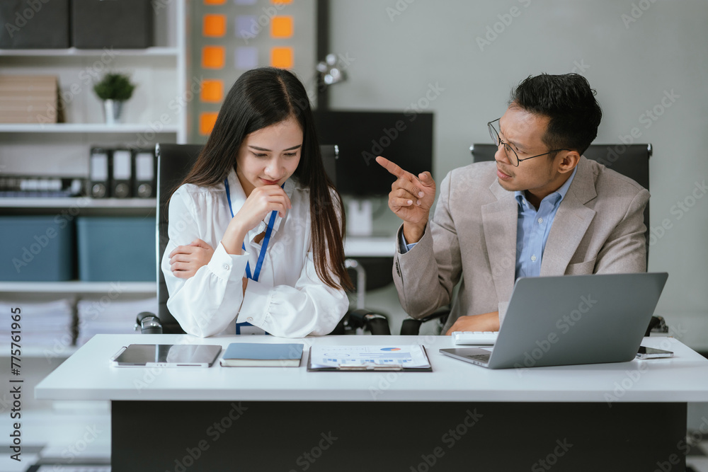 Angry boss blames sad female employee for incompetence computer error in office. Angry boss blames sad female employee for incompetence computer error in office.