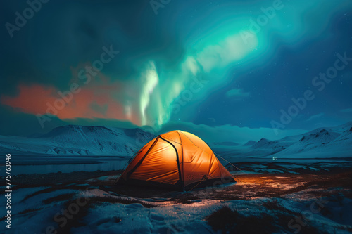 Aurora borealis over a glowing orange tent at night. Northern lights in Iceland. Starry sky with polar lights. Camping and hiking in Iceland.