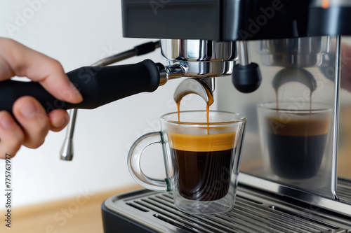Closeup of espresso machine making fresh black espresso coffee