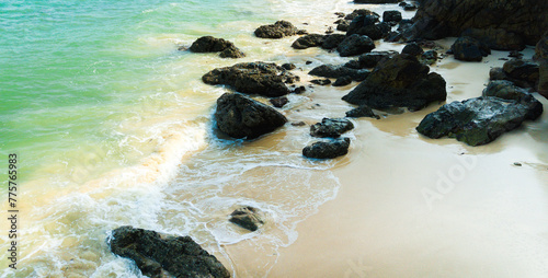 Rocks on the beach at Kapas Island on the Kuala Terengganu in Terengganu. photo