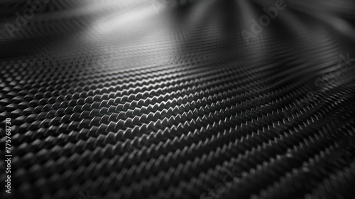 A close-up of a black carbon fiber surface