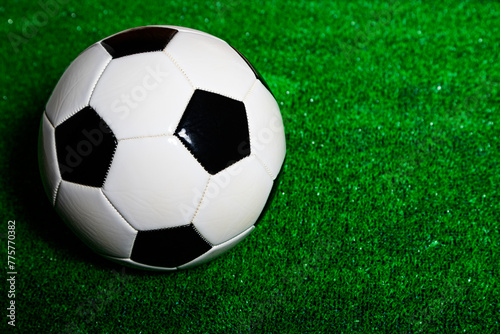 A soccer ball over a green grass field