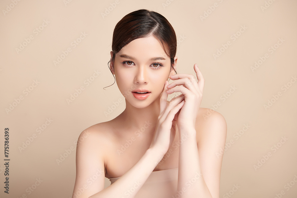 Beautiful young asian woman with clean fresh skin on beige background, Face care, Facial treatment, Cosmetology, beauty and spa, Asian women portrait. Beautiful young asian woman with clean fresh skin on beige background, Face care, Facial treatment, Cosmetology, beauty and spa, Asian women portrait.