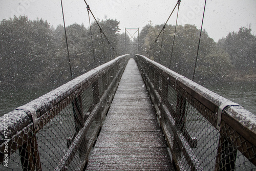 Snow on a suspension bridge
