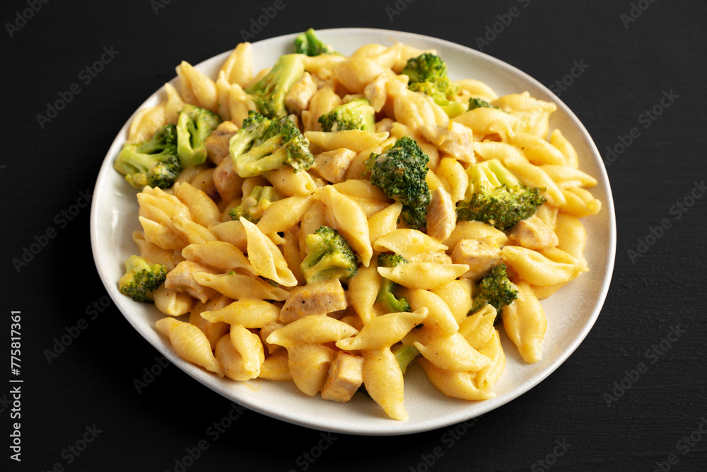 Homemade Cheesy Chicken And Broccoli Pasta on a Plate, side view.