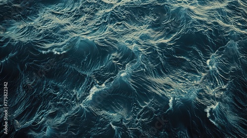 Dusk Ocean Waves - Top View Serene Water Background,Surface of sea water. Blue cold frothy wavy aqua background. Open deep sea, view from above,abstract background of blue water ripples and waves 