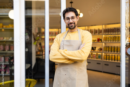 Smiling business owner at his boutique grocery shop