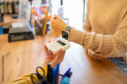 Contactless payment with smartwatch at checkout photo