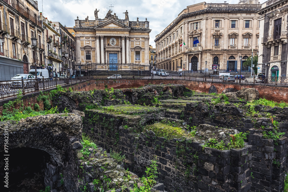 Ruins of Roman Amphitheater and San Biagio church at Stesicoro Square in historic part of Catania city, Sicily, Italy