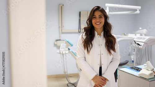 Portrait of a beautiful, young female dentist at her office