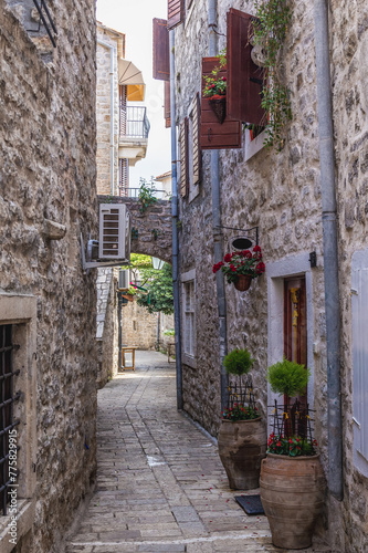 Fototapeta Naklejka Na Ścianę i Meble -  Narrow alley of Old Town, historic part of Budva town, Montenegro